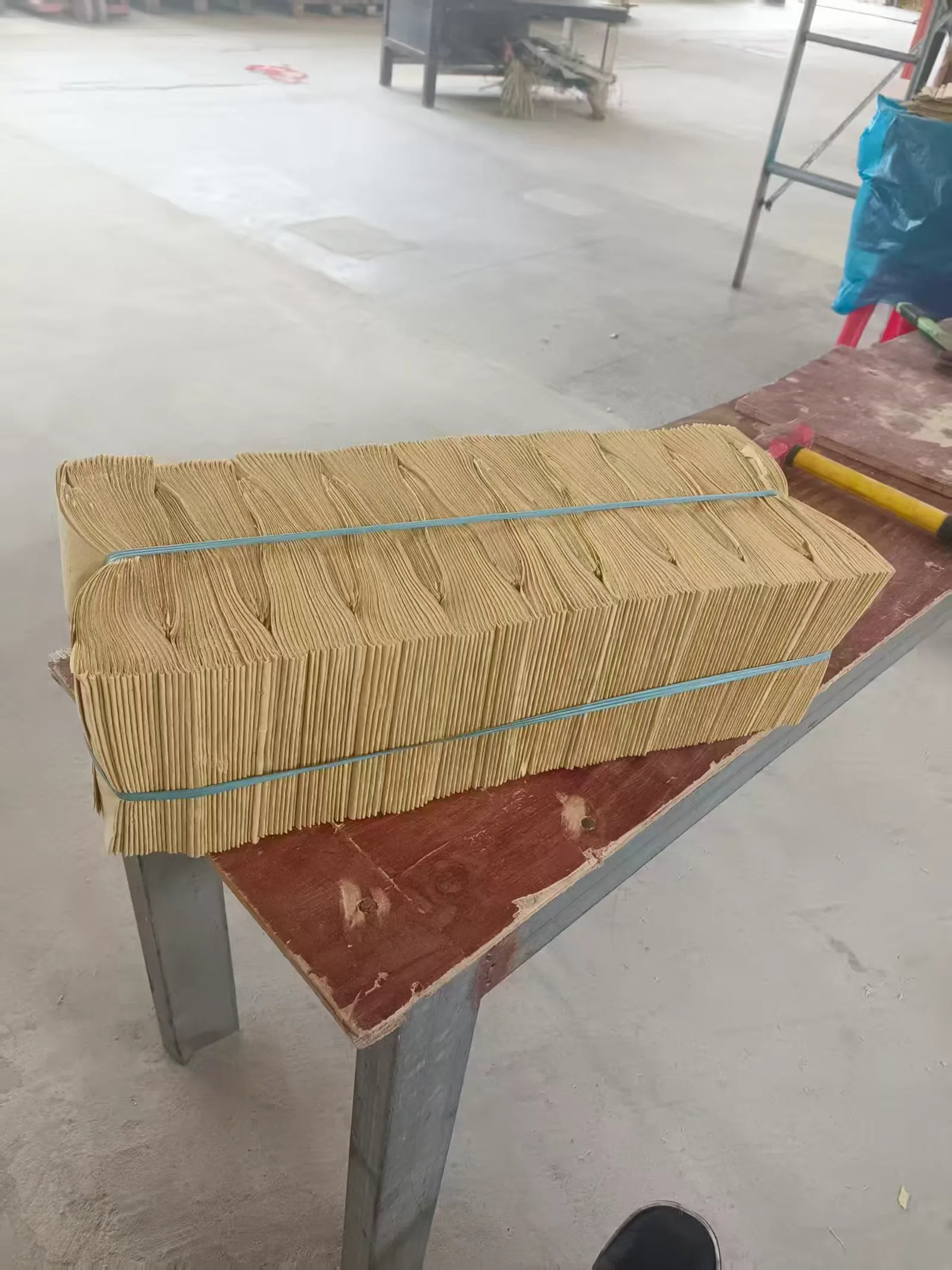 Paper products secured with plastic tying material
